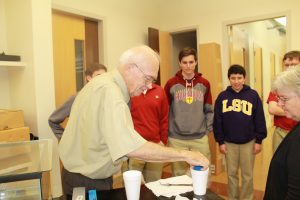 Dr. Fricken working with Ms. Picou’s physics classc while experimenting with liquid nitrogen in 2015.