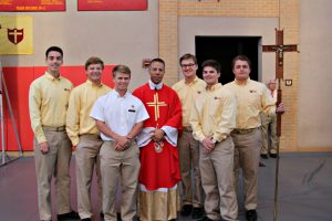 Crusaders with Fr. Kyle Dave '89 of Our Lady of Perpetual Help Parish at Mass. 