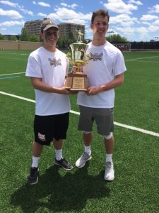 Holden Savoie '16 and Edwin Pigeon '16 holding the Div. II Trophy.