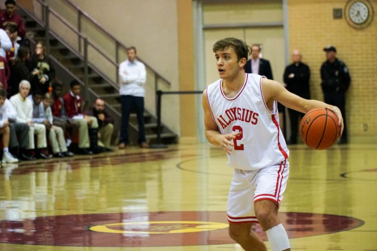 Basketball Wins Huge Upset over Jesuit on St. Aloysius Throwback Night