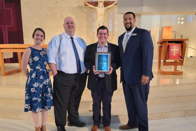 Archbishop Aymond Presents St. Timothy Award to Brother Martin Senior Ethan Cassara